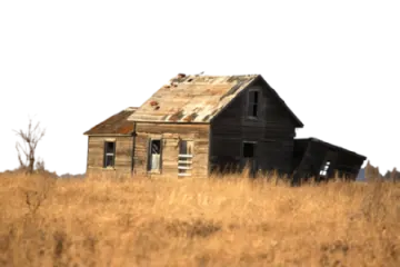 an old house in the middle of a field