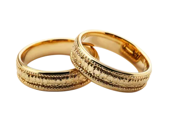 two wedding rings on a white background