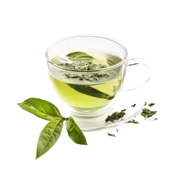 a glass cup filled with green tea