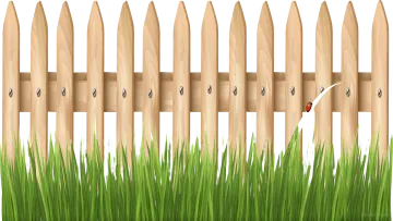 a wooden fence with grass in front of it