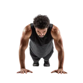 a man in a black tank top doing push ups