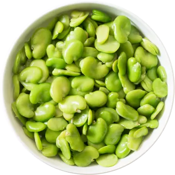 a white bowl filled with green beans