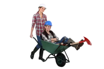 a woman pushing a child in a wheelbar