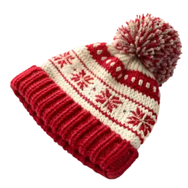 a red and white knitted hat with pom