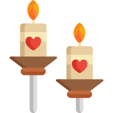 two candles with hearts on them
