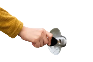 a person holding a metal object in their hand
