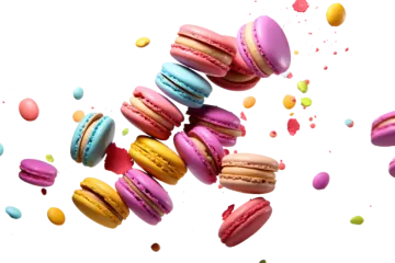 a bunch of macarons falling in the air