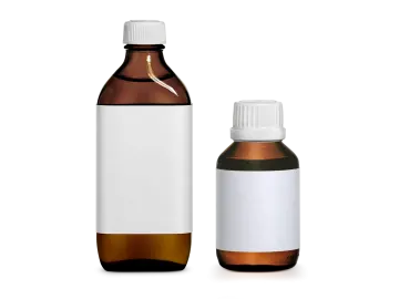 a bottle of essential oil next to an empty bottle