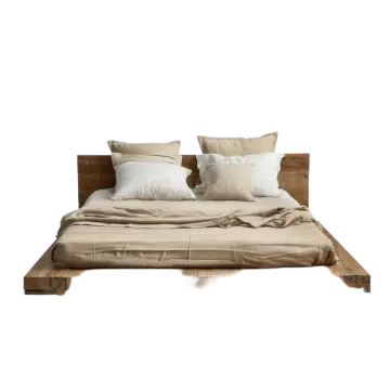 a bed with pillows and pillows on it