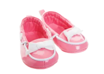 a pair of pink baby shoes with white bows