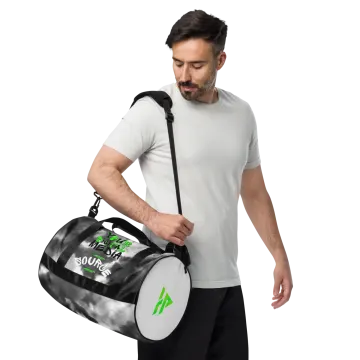 a man carrying a duff bag