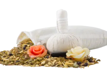a bag of tea next to some flowers