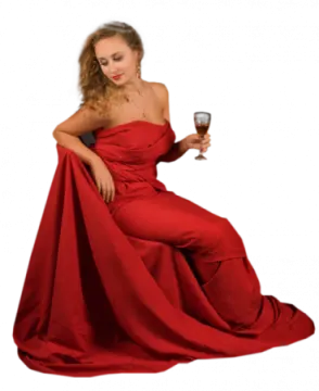 a woman in a red dress holding a wine glass