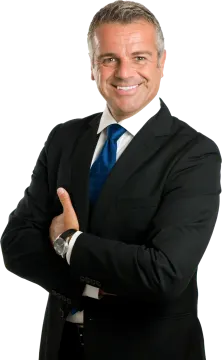 a man in a suit and tie with his arms crossed