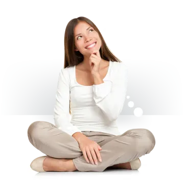 a woman sitting on the floor with her hand to her mouth