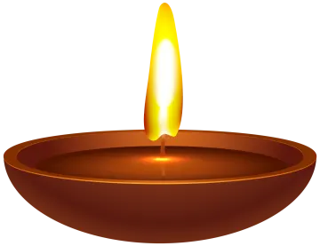 a lit candle in a brown bowl