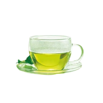 a glass cup filled with green tea