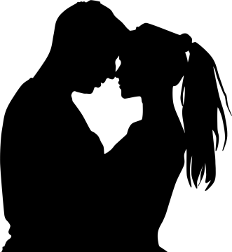 a silhouette of a couple kissing