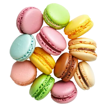 a pile of colorful macarons on a white background