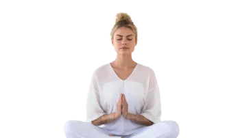 a woman sitting in the middle of a yoga pose