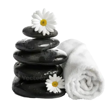a stack of black stones with white flowers on top
