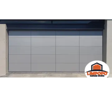 a grey garage door with an orange and white logo on it