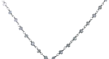 a silver necklace with blue and white crystals on it