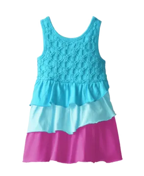 a little girl wearing a blue and pink dress