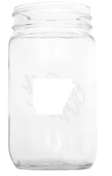 a clear glass jar with a white logo on it