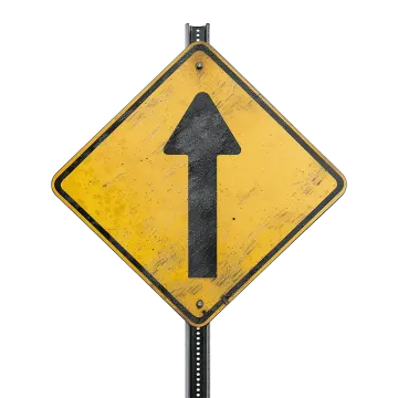 a yellow sign with an arrow on it