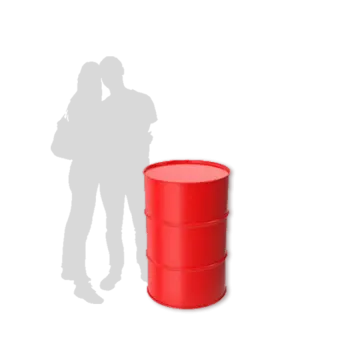 a person standing next to a red barrel