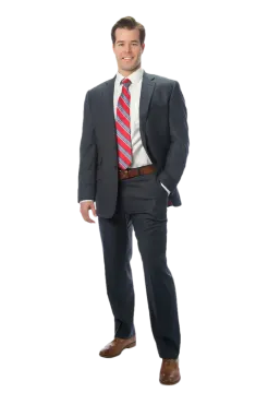 a man in a suit and tie standing