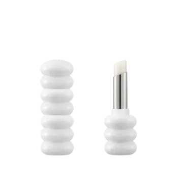 a pair of white glass knobs on a white background
