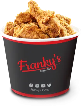 a cup filled with fried chicken on a white background
