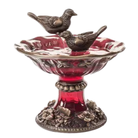 a bird sitting on top of a glass bowl