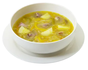 a bowl of soup on a white plate