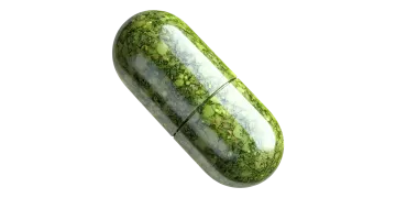 A green pill on a white background