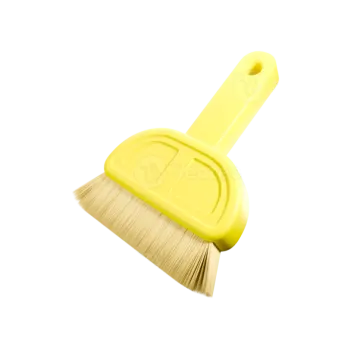 a yellow broom with a handle on a white background