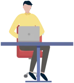 a person sitting at a table with a laptop