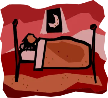 a bed with a cat sitting on top of it