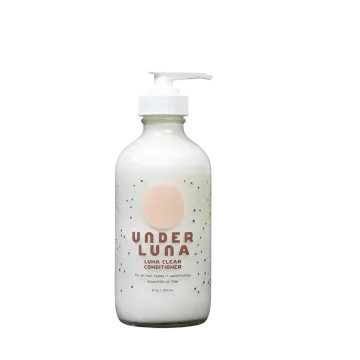 a bottle of soap with a pink dot on it