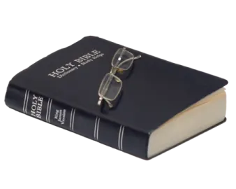a book with glasses on top of it