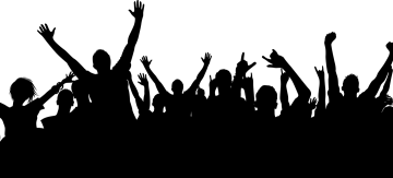 a crowd of people with their hands in the air