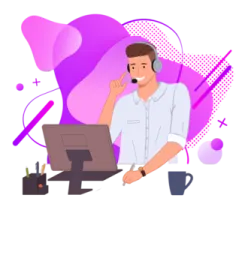 a man sitting at a desk with a laptop and headphones