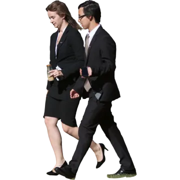 a man and woman in business attire walking