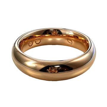 a gold wedding ring on a white background