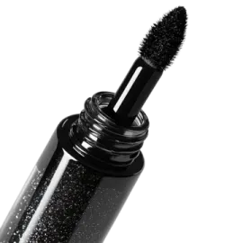 a mascara with black glitter on it