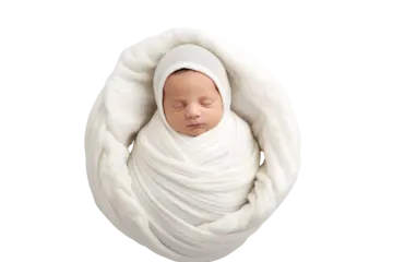 a newborn wrapped in a white blanket
