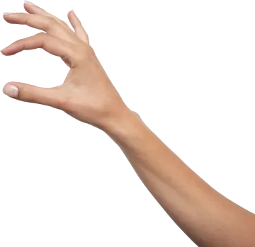 a person's hand reaching towards a white object