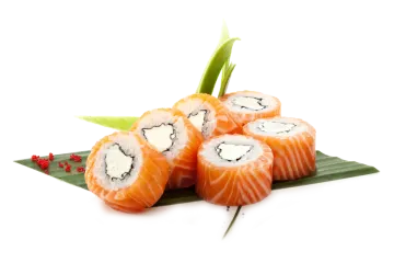 a piece of salmon roll on top of a leaf